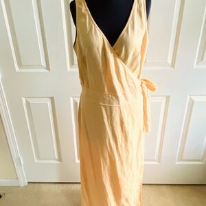 Light peach long linen wrap dress with a side tie. Made by Bloomingdale’s